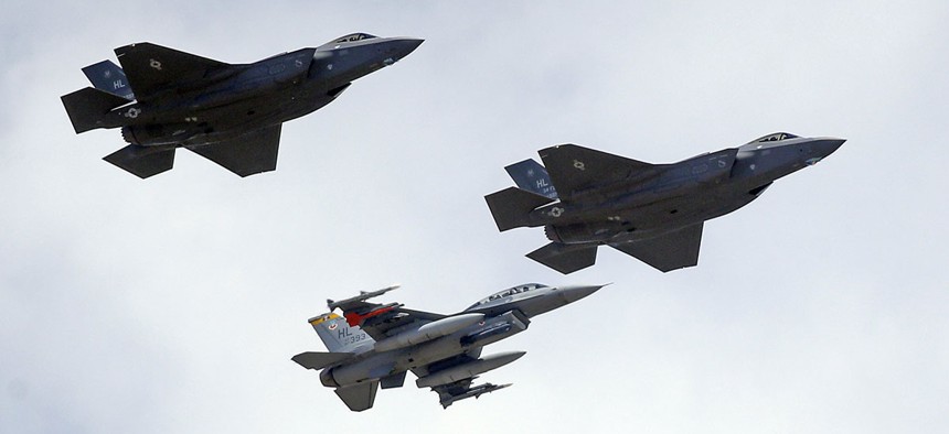 An F-16, below, escorting two F-35 jets, above, after arriving the latter arrived at Hill Air Force Base in Utah.