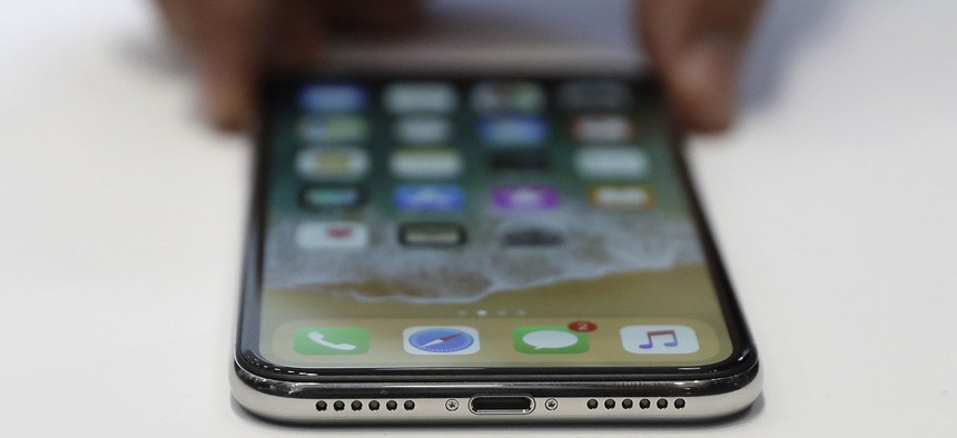 The new iPhone X is displayed in the showroom after the new product announcement at the Steve Jobs Theater on the new Apple campus in Cupertino, Calif.