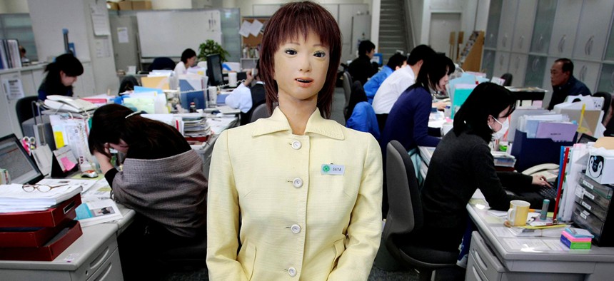 Japan's robot Saya, developed by Hiroshi Kobayashi, Tokyo University of Science professor, works as a receptionist at the university's front desk in Tokyo, Japan, Wednesday, March 11, 2009. 