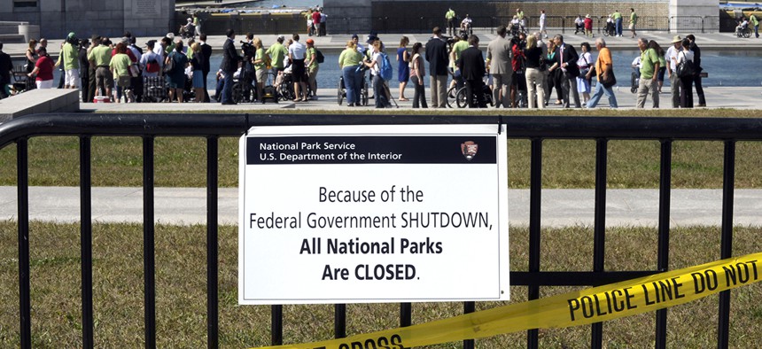 In 2013, people visited the closed World War II Memorial on the National Mall in Washington, despite signs stating that the national parks are closed due to the federal shutdown.