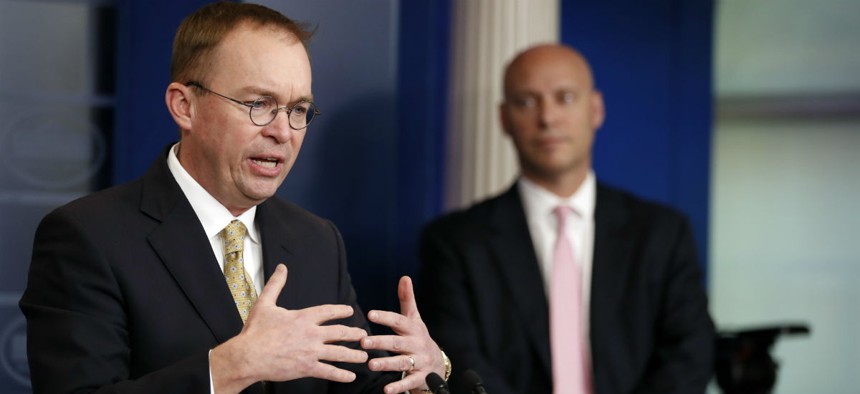 Director of the Office of Management and Budget Mick Mulvaney, left, speaks as Marc Short, White House director for legislative affairs, stands nearby during a press briefing at the White House, Saturday, Jan. 20, 2018.