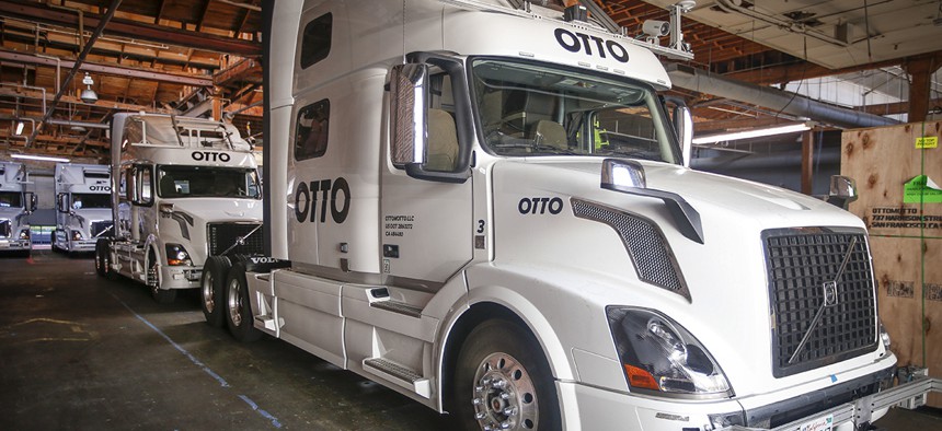 Otto's self-driving, big-rig trucks are lined up during a demonstration at the Otto headquarters on Thursday, Aug. 18, 2016, in San Francisco.