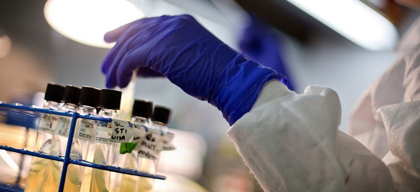 A microbiologist works with tubes of bacteria samples in an antimicrobial resistance and characterization lab within the Infectious Disease Laboratory at the Centers for Disease Control and Prevention in Atlanta. 