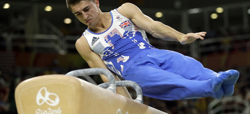 Britain's Max Whitlock performs on the pommel horse during the artistic gymnastics men's apparatus final at the 2016 Summer Olympics in Rio de Janeiro.