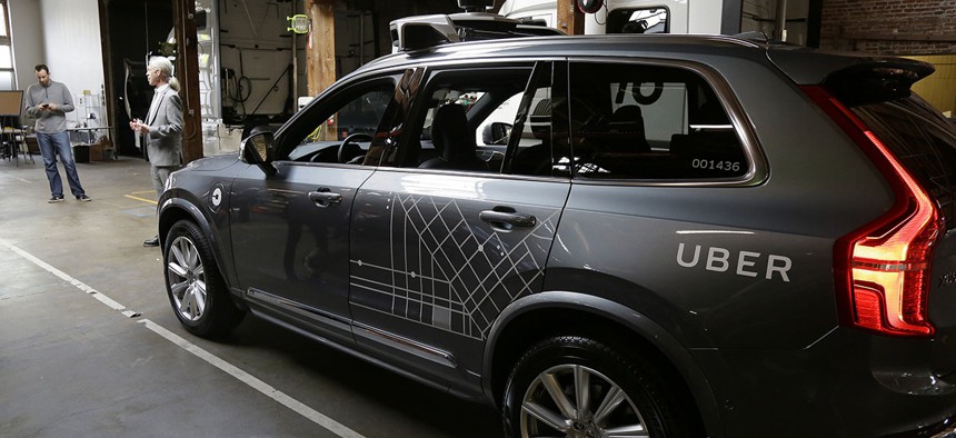 An Uber driverless car is displayed in a garage in San Francisco. 