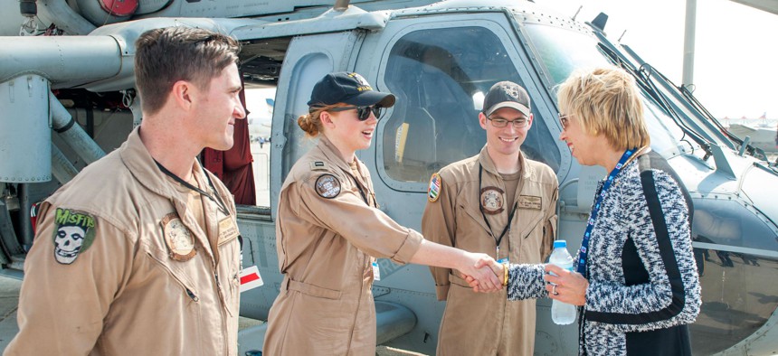 Ellen Lord meets the “Wildcards” of Helicopter Sea Combat Squadron 23 during the International Air Show in the Dubai World Center in November.