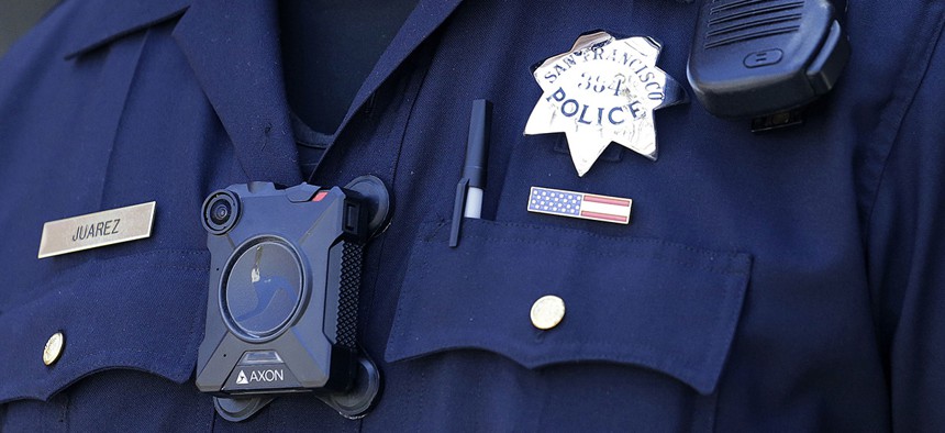 San Francisco Police officer Joe Juarez wears a body camera while patrolling outside of AT&T Park before a baseball game.