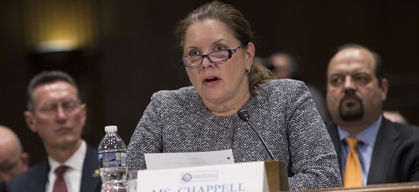 Jane Chappell, vice president of Global Intelligence Solutions at Raytheon, testifies before the Senate Intelligence Committee as lawmakers examine problems and practices of issuing security clearances to government employees.