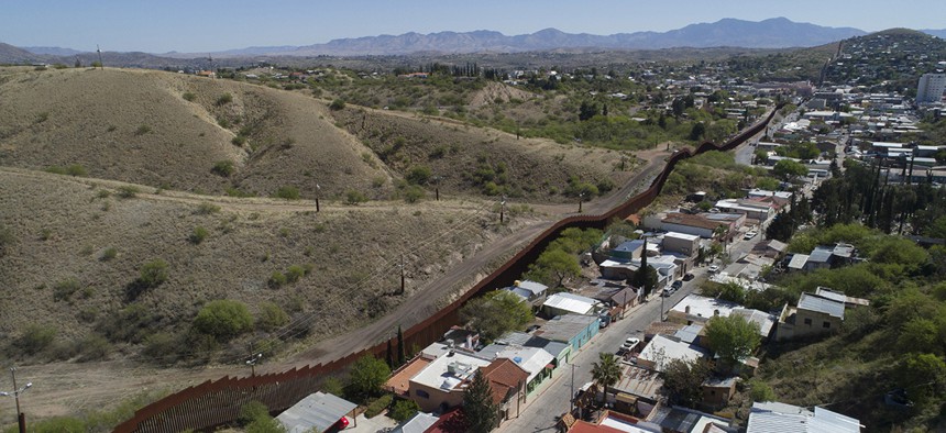 This photo made with a drone, shows the U.S. Mexico border fence as it cuts through the two downtowns of Nogales, Ariz. 