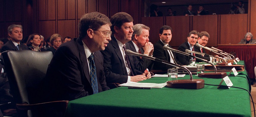 Microsoft President Bill Gates, left, and other software industry executives testify on Capitol Hill, Tuesday, March 3, 1998.