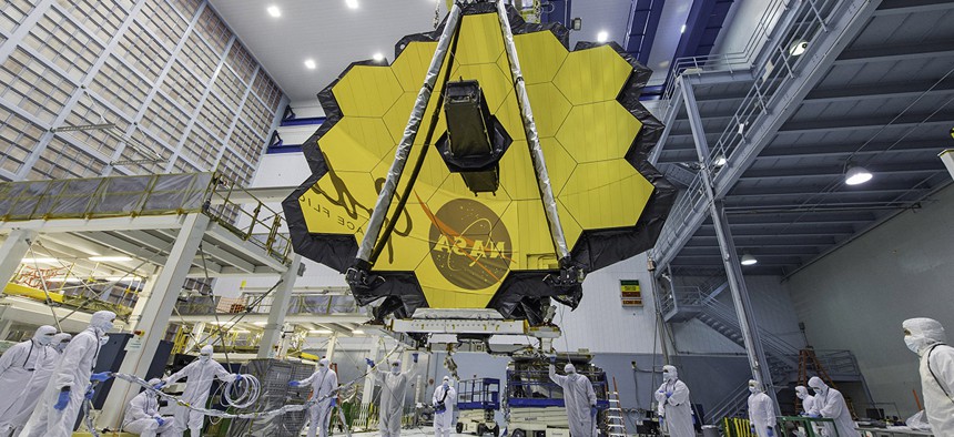 Technicians lift the mirror of the James Webb Space Telescope using a crane at the Goddard Space Flight Center in Greenbelt, Md. 