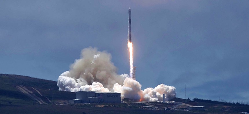 A SpaceX Falcon 9 rocket carrying two U.S.-German science satellites and five commercial communications satellites blasts off from Vandenberg Air Force base.