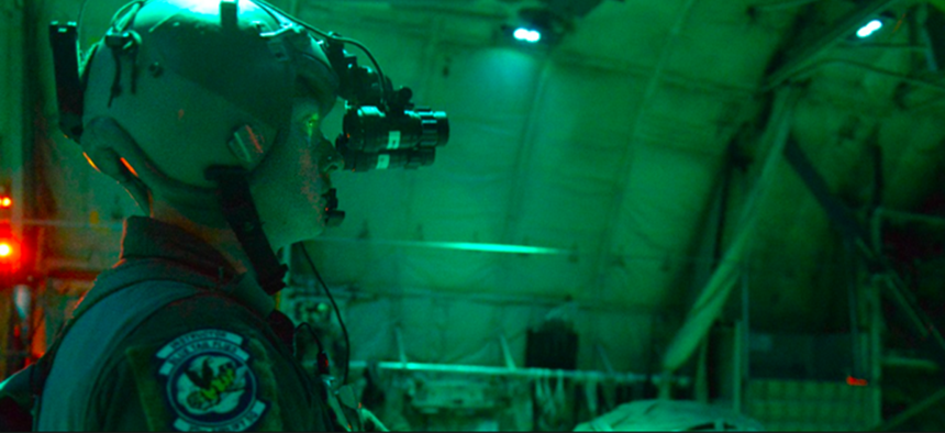 A U.S. Air Force loadmaster uses night vision goggles during a night flight over Bulgaria, July 15, 2018.