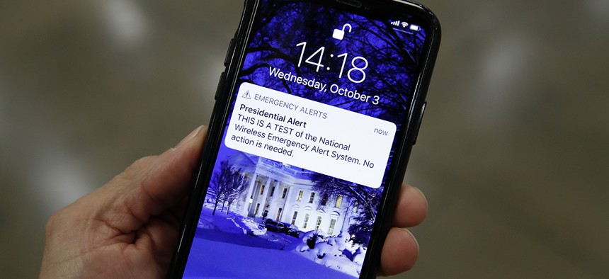 A presidential emergency alert test is seen on a phone on Capitol Hill.