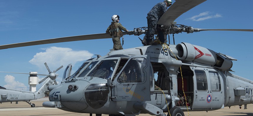 Sailors of Helicopter Sea Combat Squadron (HSC) 28 prepare MH-60S Sea Hawk helicopters.