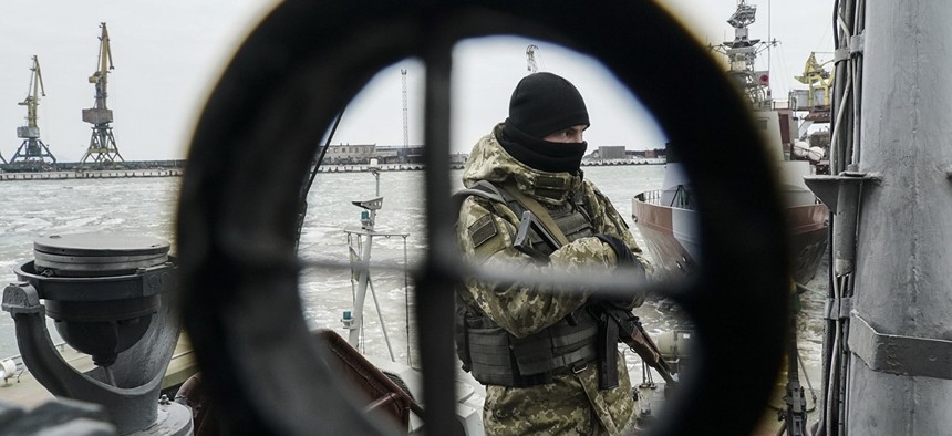 A Ukrainian serviceman stands on board a coast guard ship in the Sea of Azov port of Mariupol, eastern Ukraine, Monday, Dec. 3, 2018.