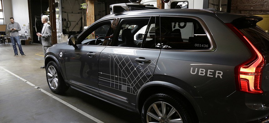 An Uber driverless car is displayed in a garage in San Francisco.