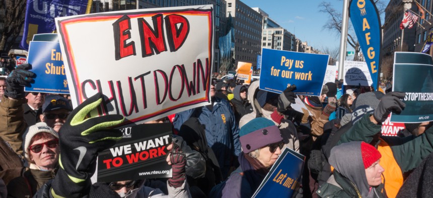 Furloughed and unpaid working federal employees, union members, contractors and supporters protest government shutdown in D.C. Jan. 10.