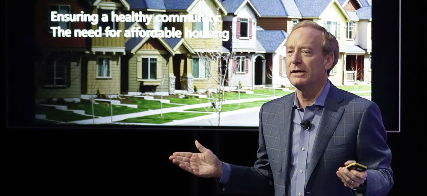 Microsoft Corp. President Brad Smith speaks Jan. 17 in Bellevue, Wash., to announce a $500 million pledge by Microsoft to develop affordable housing for low- and middle-income workers in Seattle.