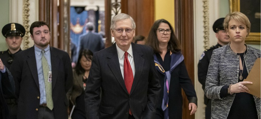 Senate Majority Leader Mitch McConnell, R-Ky., leaves the chamber after Senate Democrats blocked President Donald Trump's request for $5.7 billion to construct his long-sought wall along the U.S-Mexico border, as a partial government shutdown continues.