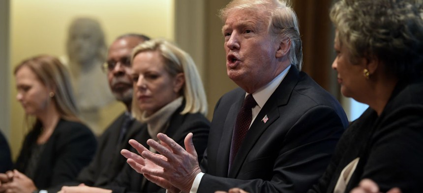 President Donald Trump, second from right, speaks in the Cabinet Room of the White House in Washington, Wednesday, Jan. 23, 2019, as he hosts a roundtable with conservative leaders to discuss the security and humanitarian crisis at the southern border.