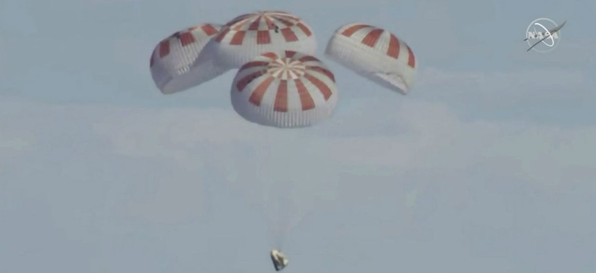 SpaceX's Dragon capsule carrying a test dummy splashed down into the Atlantic ocean off the Florida coast March 8.
