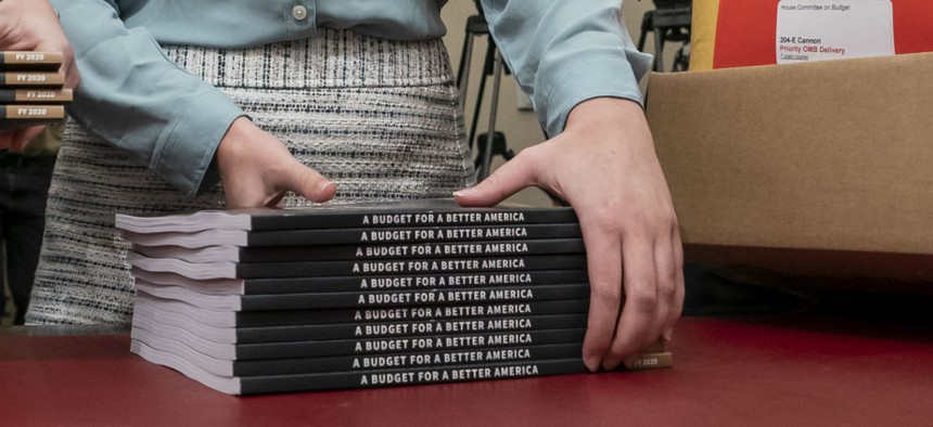 Office of Management and Budget staff delivers President Donald Trump's 2020 budget outline to the House Budget Committee on Capitol Hill in Washington, March 11.
