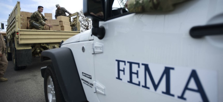 Department of Homeland Security personnel deliver supplies to Santa Ana community residents in the aftermath of Hurricane Maria in Guayama, Puerto Rico.