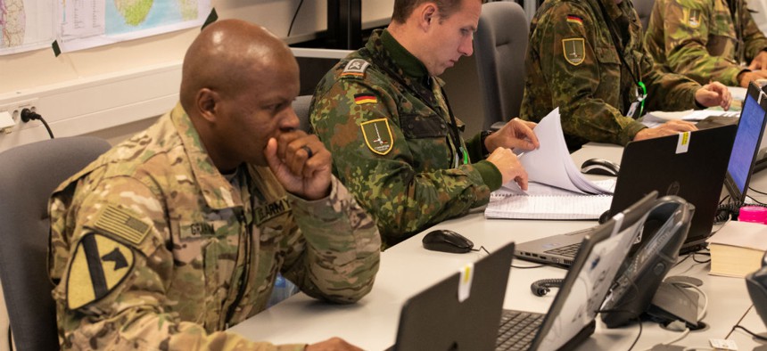American and German soldiers work in the Tactical Operations Center at 1st German Netherlands Corps Headquarters for Trident Juncture 2018 in Norway in October.