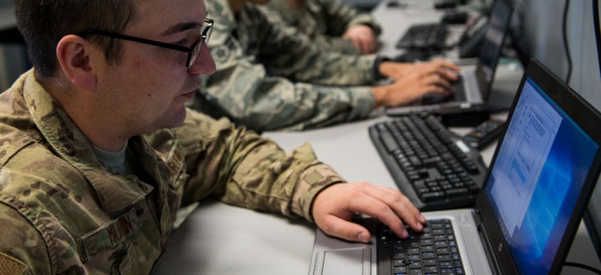 An airman troubleshoots a computer at the hub at Barksdale Air Force Base.
