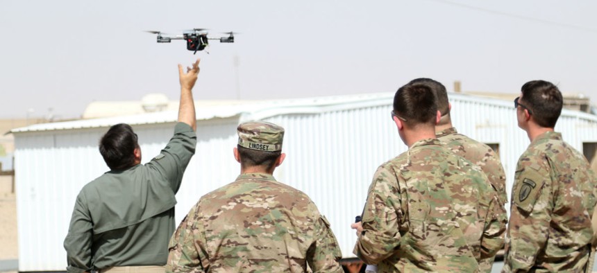 Instructors from ARCENT Readiness Training Center - Kuwait demonstrate how to launch a drone using Instant Eye technology for 1st Security Forces Assistance Brigade soldiers March 2018.