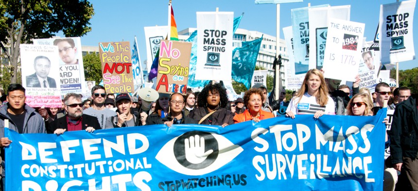 Protesters rally against mass surveillance during an event organized by the group Stop Watching Us in Washington, D.C., on Oct. 26, 2013.
