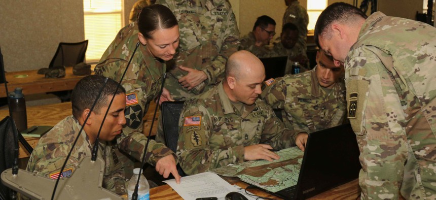 Army paratroopers participate in pre-mission planning during the Electronic Warfare competition at Fort Bragg, North Carolina, in May. 