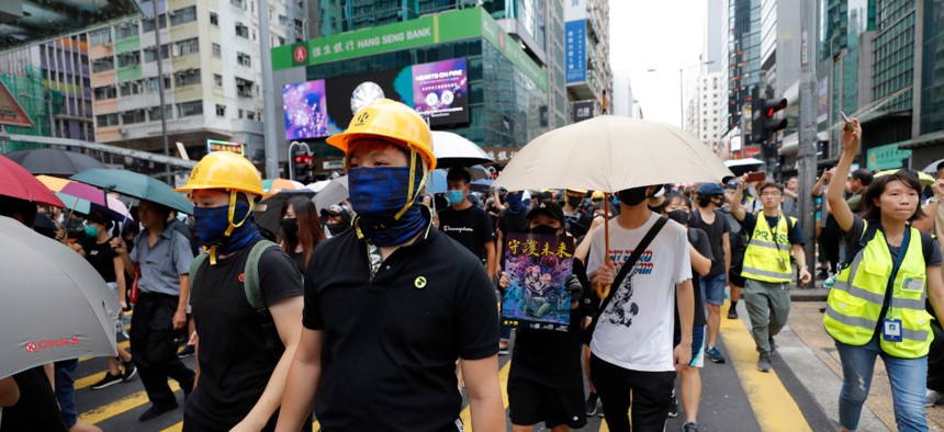 Protestors march through the Mong Kok neighborhood during a demonstration in Hong Kong, Aug. 3, 2019. 