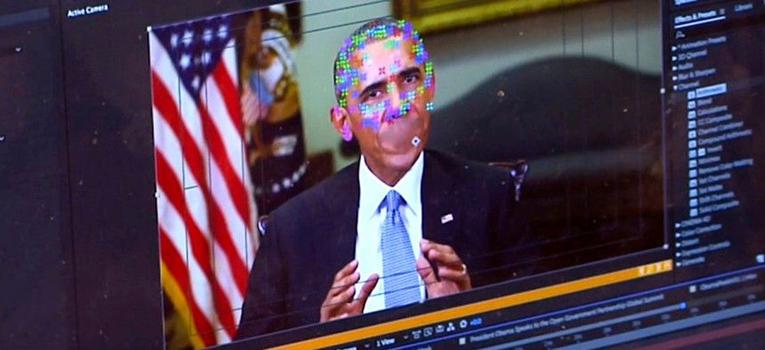 This image made from video of a fake video featuring former President Barack Obama shows elements of facial mapping used in new technology that lets anyone make videos of real people appearing to say things they've never said. 
