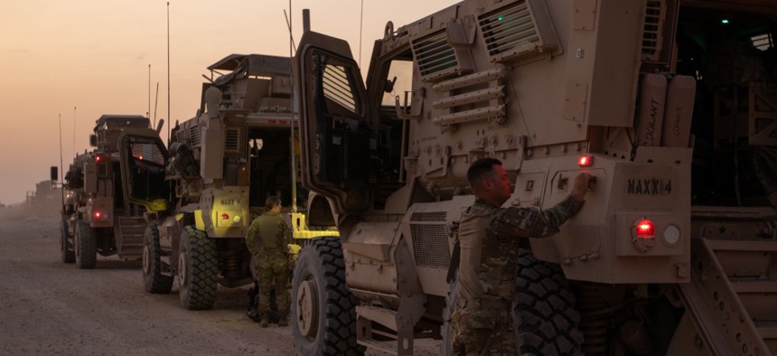 Soldiers from 3rd RCP conduct final pre-convoy checks and inspections of their vehicles before exiting their base. 