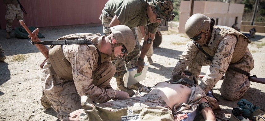 Navy sailors assess a simulated casualty as part of the Field Medical Service Technician Course final exercise on Marine Corps Base Camp Pendleton, California, in September. 