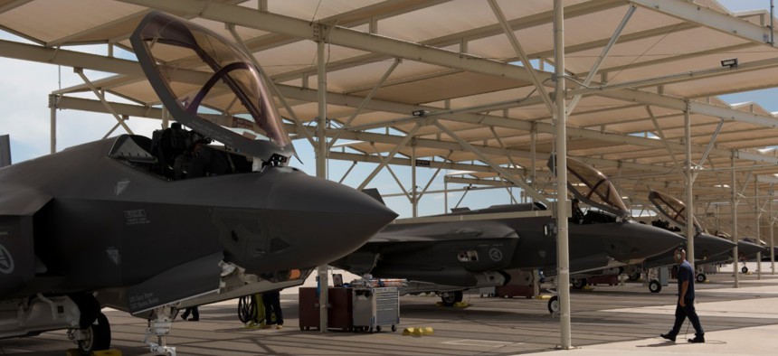 A maintainer inspects F-35 Lightning IIs before they launch from Luke Air Force Base, Arizona.
