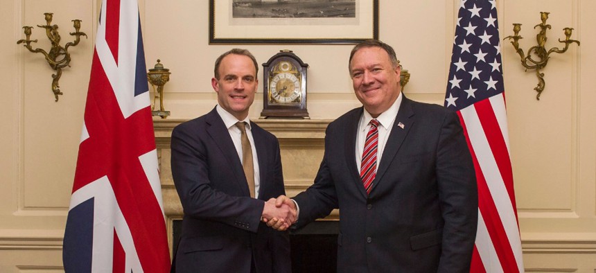 U.K. Foreign Secretary Dominic Raab shakes hands with U.S. Secretary of State Mike Pompeo, right, in London Jan. 29.