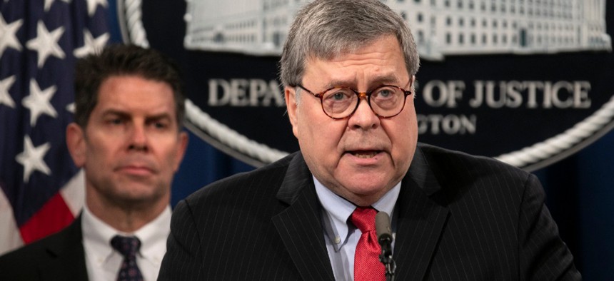 Attorney General William Barr, right, next to FBI Deputy Director David Bowdich, announces charges against Chinese nationals for hacking Equifax.