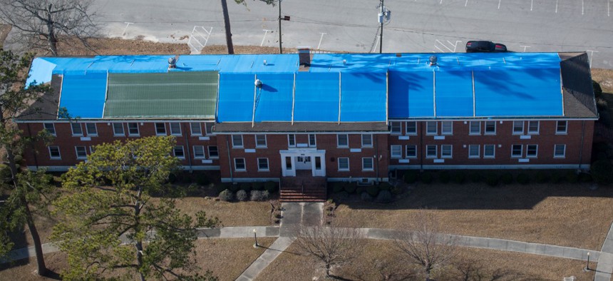 Several buildings remain covered in tarps five months after Hurricane Florence at Camp Lejeune, N.C., Feb. 1, 2019. 