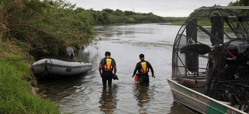 This July 2, 2019 photo provided by the U.S. Customs and Border Protection Agency shows a U.S. Border Patrol Del Rio Sector Dive Team searching for a 2-year-old Haitian girl in Rio Grande River in Del Rio, Texas. 