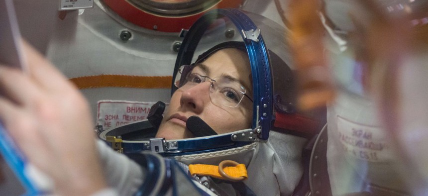 At the Baikonur Cosmodrome in Kazakhstan, NASA astronaut Christina Koch works inside the Soyuz MS-12 spacecraft Feb. 27 during pre-launch training.