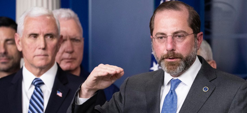 Health and Human Services Secretary Alex Azar speaks, with Vice President Mike Pence behind him, during a briefing about the coronavirus in the James Brady Press Briefing Room of the White House March 15.
