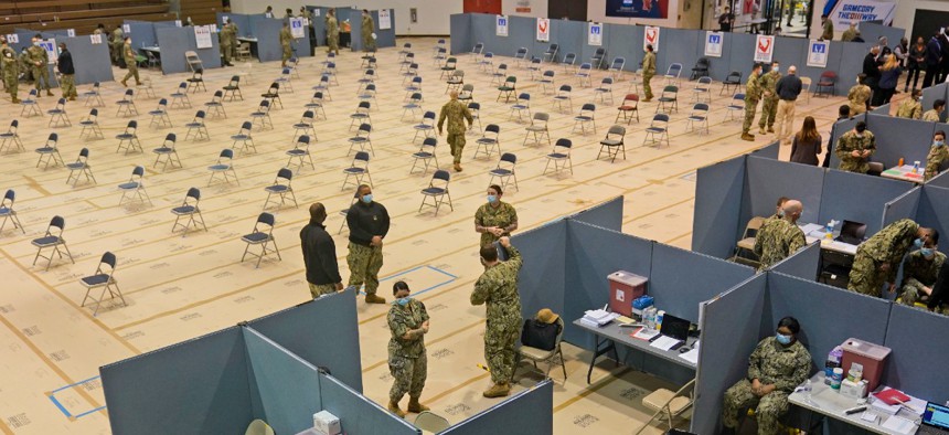 Primarily Navy personnel prepare for the opening of a FEMA-run mass COVID-19 vaccination site in the Queens borough of New York Feb. 24.