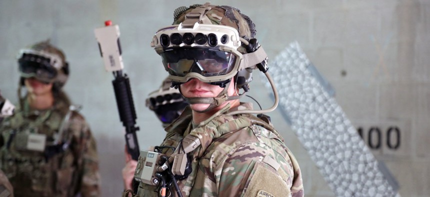Soldiers wear a militarized form factor prototype of the Army’s Integrated Visual Augmentation System and wield a Squad immersive Virtual Trainer during a training environment test event at its third Soldier Touchpoint at Fort Pickett, Virginia in 2020..