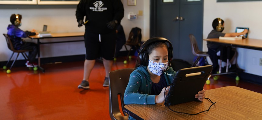 In this Aug. 26, 2020, file photo Los Angeles Unified School District students attend online classes at Boys & Girls Club of Hollywood in Los Angeles. 