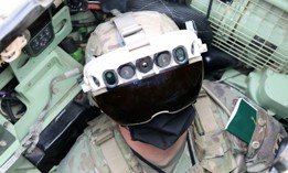 Soldier dons the Integrated Visual Augmentation System Capability Set 3 hardware while mounted on a Bradley in Joint Base Lewis-McCord.