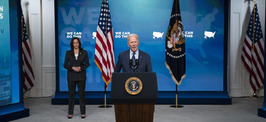 Vice President Kamala Harris listens as President Joe Biden speaks about the COVID-19 vaccination program, in the South Court Auditorium on the White House campus, Wednesday, June 2, 2021, in Washington