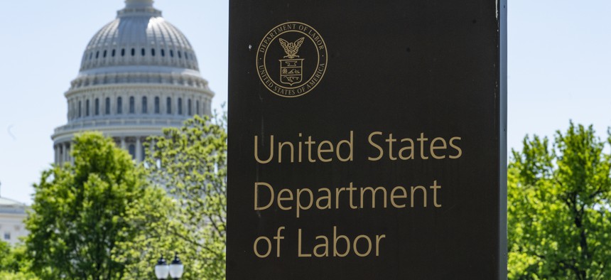 In this May 7, 2020, file photo, the entrance to the Labor Department is seen near the Capitol in Washington. Unemployment fraud in the U.S. has reached dramatic levels during the pandemic.